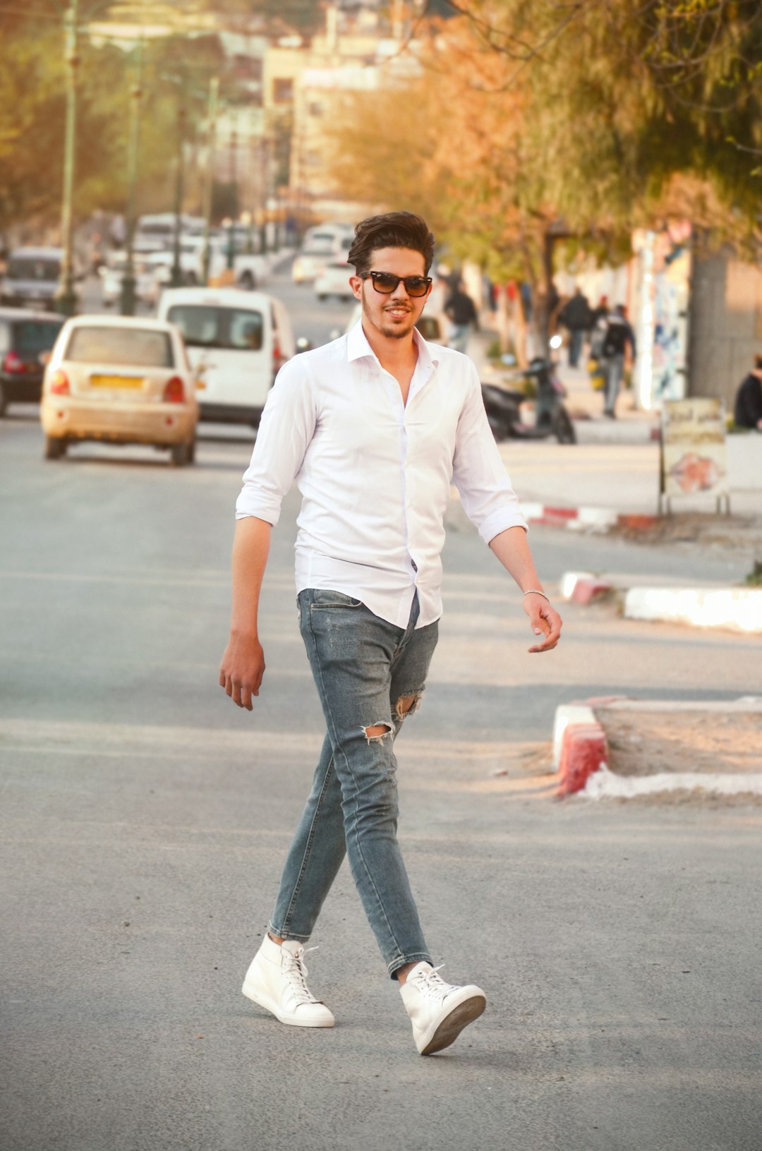 Home man-wearing-white-dress-shirt-and-distress-blue-jeans-standing-on-road-2bozxtzhaum